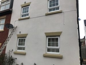 WHITE COAX ON A WHITE WALL